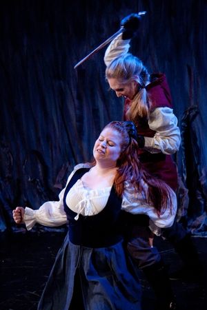 Lady Macduff (Rachel Stubbs) is murdered by Lenox (Gillian N. Humiston) @ BroadwayWorld Lady Macduff (Rachel Stubbs) is murdered by Lenox (Gillian N. Humiston) Photo